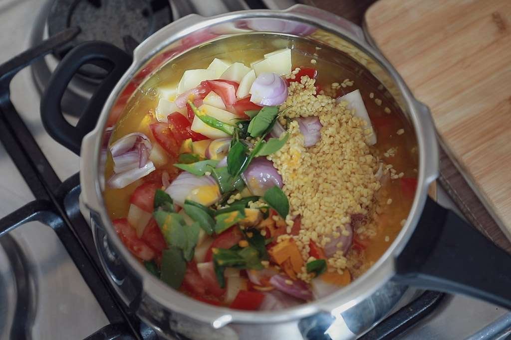 onions curryleaves tomato dal in pressure cooker