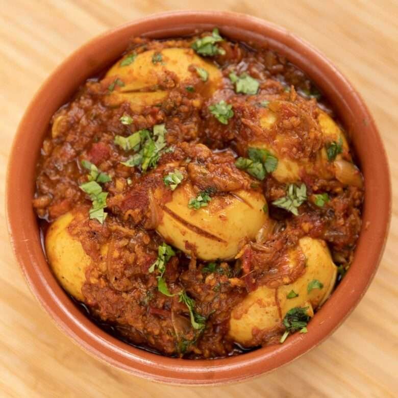 top angle of egg curry with thick gravy