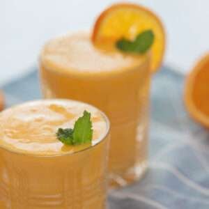 mango tango juice with sliced mango and orange