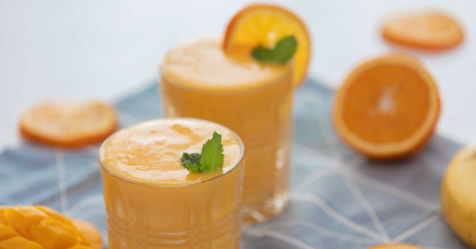 mango tango juice with sliced mango and orange