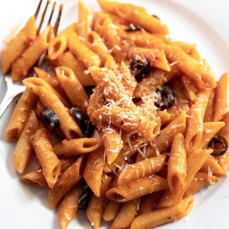 pasta with parmesan cheese served on plate