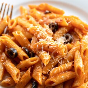 spicy pasta served on white bowl