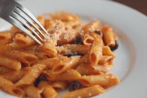 picking pasta with fork