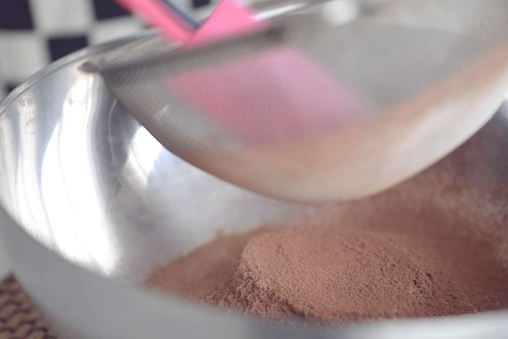 sieving cocoa powder