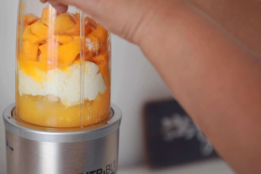 mixing mango and yoghurt on nutribullet