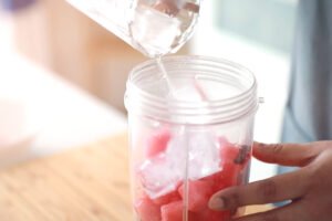 ice and watermelon pieces on mixer