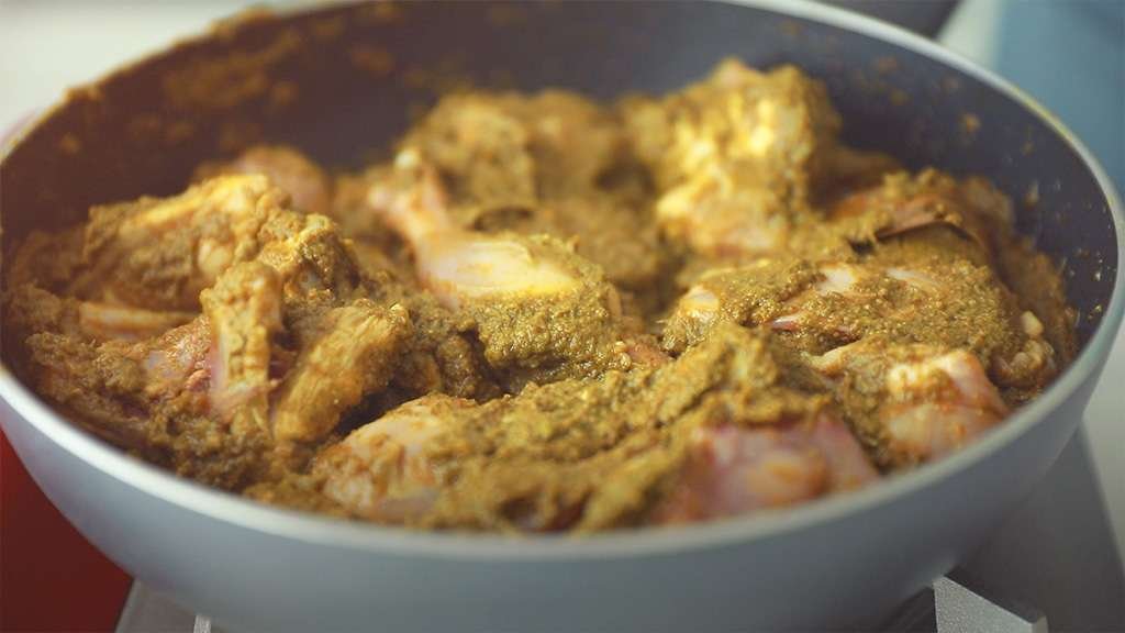 chicken with green masala on pan