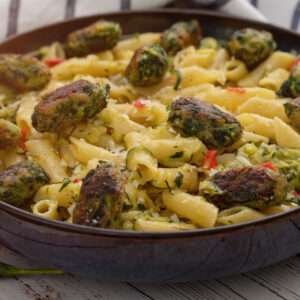 plate of spinach zucchini penne pasta