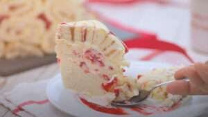 piece of swiss roll ice cream cake on saucer